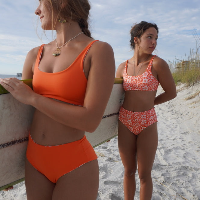 Reversible Hawaiian floral bikini top with adjustable straps, perfect for beach adventures.
