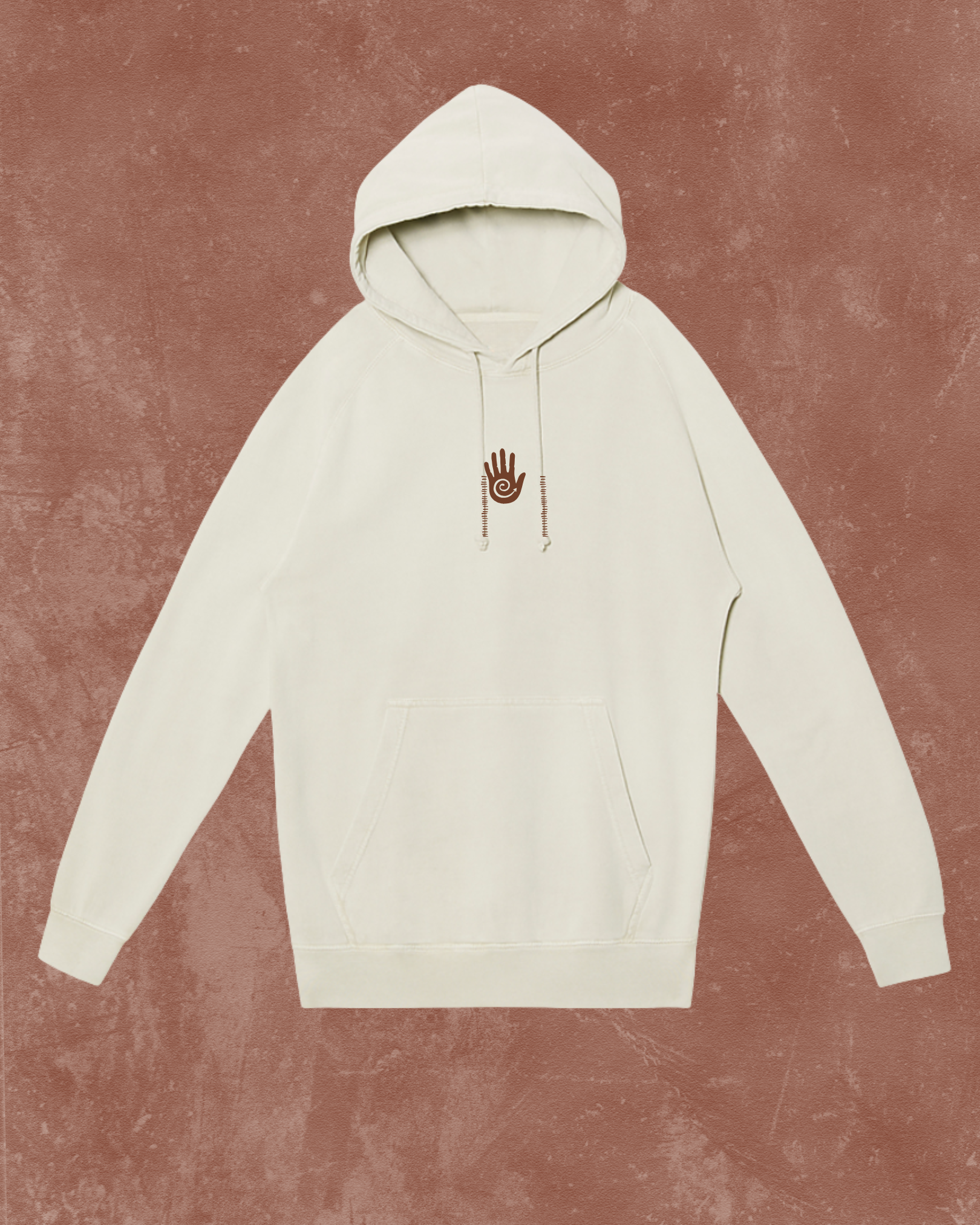 White hoodie with a small logo on a textured brown background
