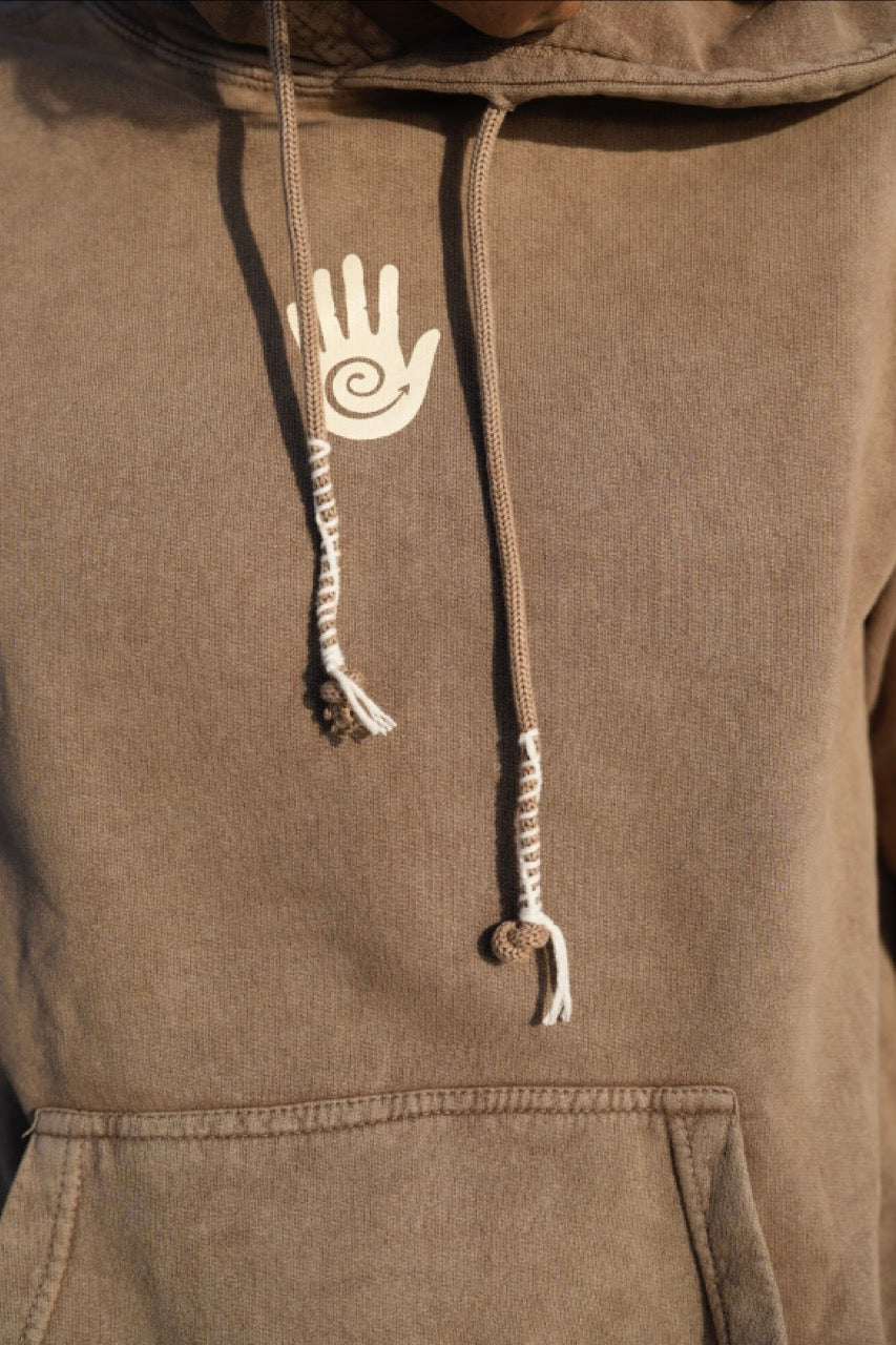 Brown hoodie with a hand design on the drawstring